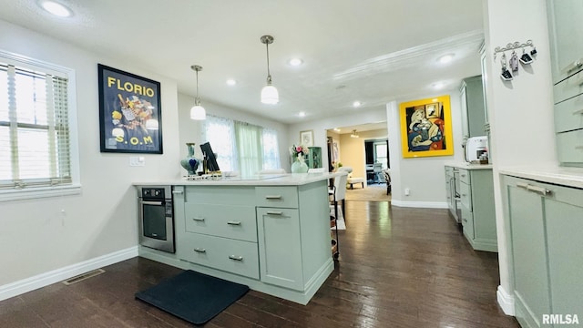 308 W Reed St, Benton, IL 62812 - kitchen with green cabinetry, a peninsula, light countertops, and recessed lighting