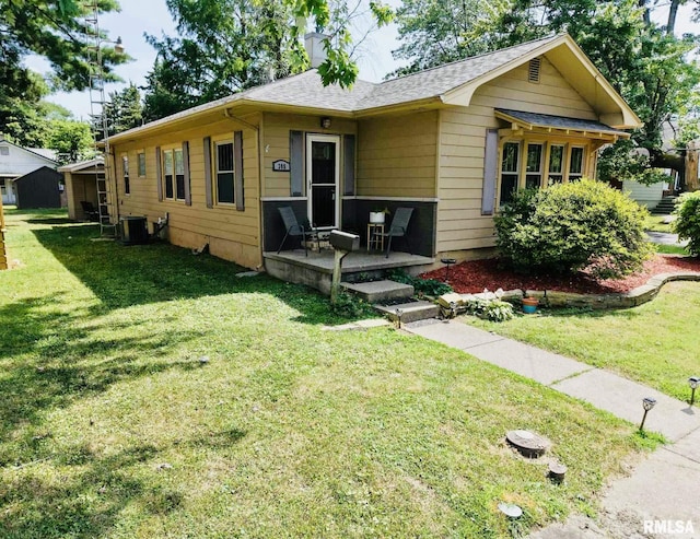 308 W Reed St, Benton, IL 62812 - view of front of home with a front yard, roof with shingles, and a chimney