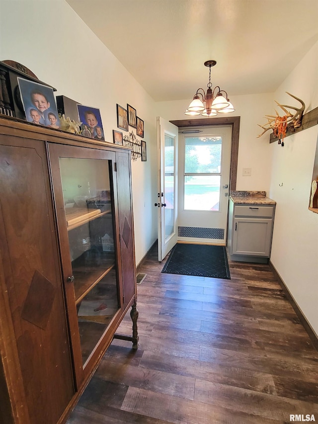 232 Palm Ln, Flora, IL 62839 - foyer entrance with dark wood finished floors and a chandelier