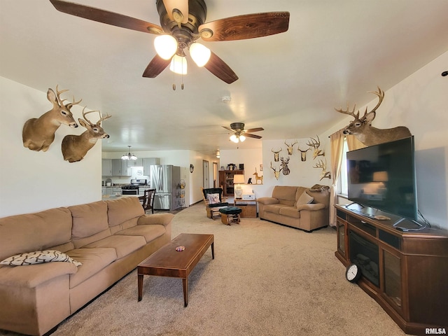 232 Palm Ln, Flora, IL 62839 - living area with a ceiling fan and light colored carpet
