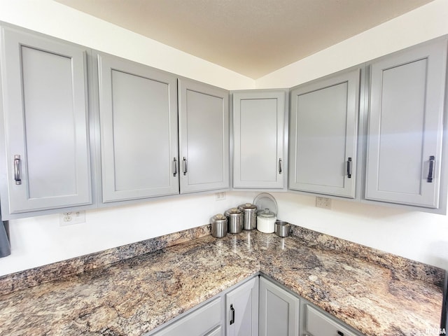 232 Palm Ln, Flora, IL 62839 - kitchen featuring gray cabinetry and dark stone countertops