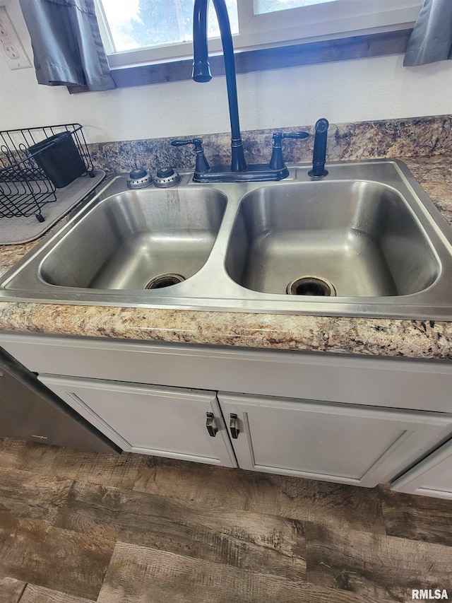 232 Palm Ln, Flora, IL 62839 - kitchen view of a sink and white cabinetry