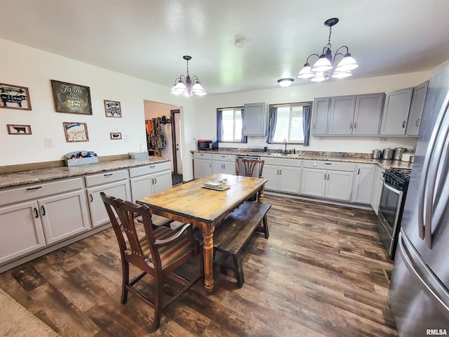 232 Palm Ln, Flora, IL 62839 - dining room featuring a chandelier and dark wood-style floors