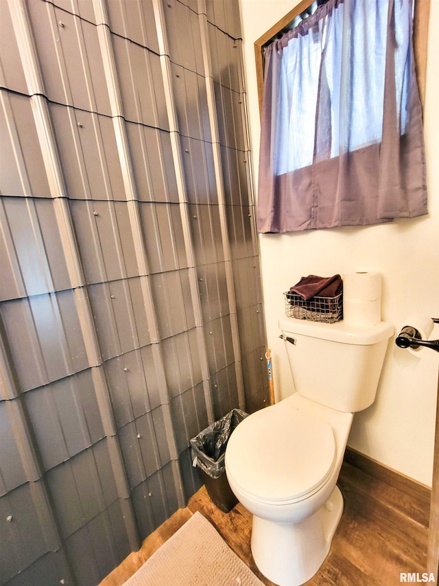 232 Palm Ln, Flora, IL 62839 - bathroom featuring toilet and wood finished floors