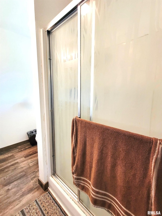 232 Palm Ln, Flora, IL 62839 - bathroom with wood finished floors and an enclosed shower
