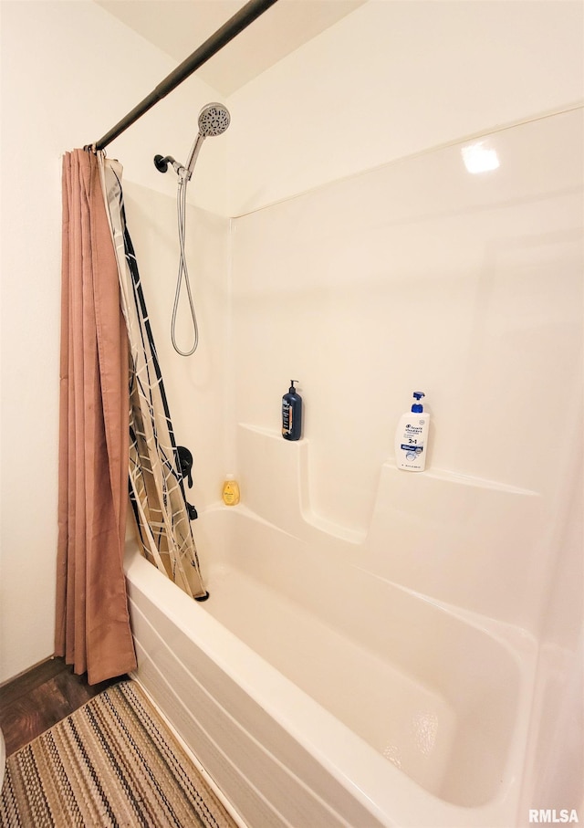 232 Palm Ln, Flora, IL 62839 - full bathroom featuring shower / bath combo with shower curtain and wood finished floors