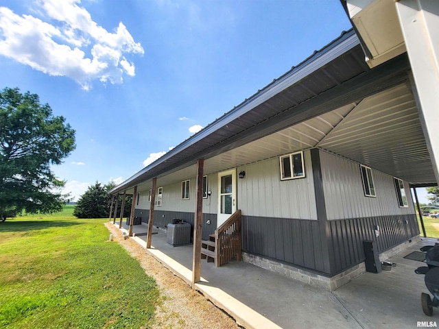 232 Palm Ln, Flora, IL 62839 - view of side of home with a yard, a patio, and crawl space