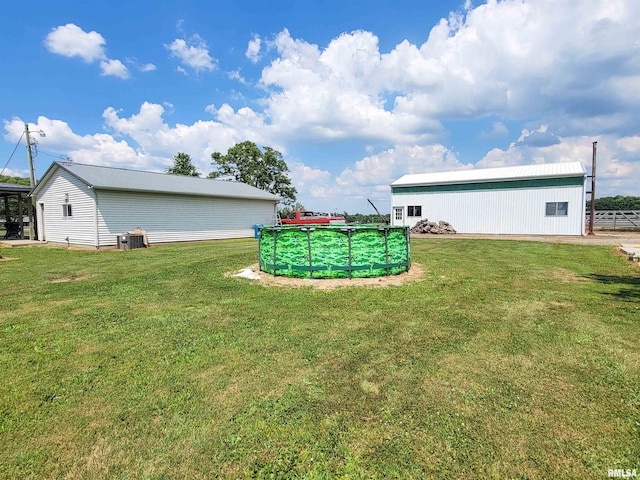 232 Palm Ln, Flora, IL 62839 - view of green lawn with an outbuilding