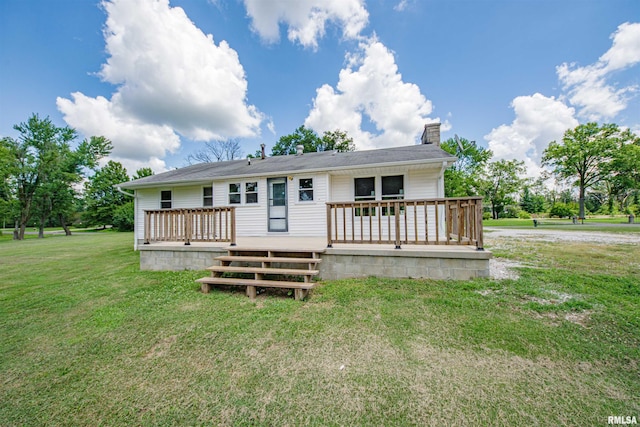 1471 Woods Ln, Centralia, IL 62801 - back of house featuring a wooden deck, a chimney, and a lawn