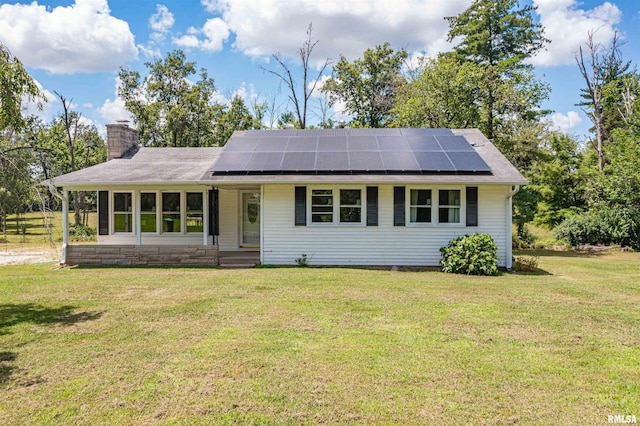 1471 Woods Ln, Centralia, IL 62801 - ranch-style home featuring solar panels, a chimney, and a front yard
