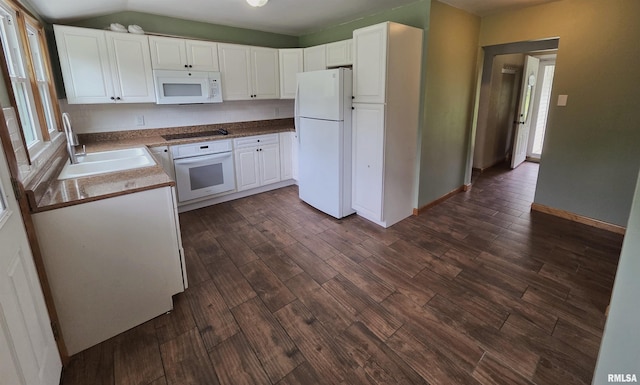 1471 Woods Ln, Centralia, IL 62801 - kitchen with white appliances, dark wood-type flooring, white cabinetry, and plenty of natural light