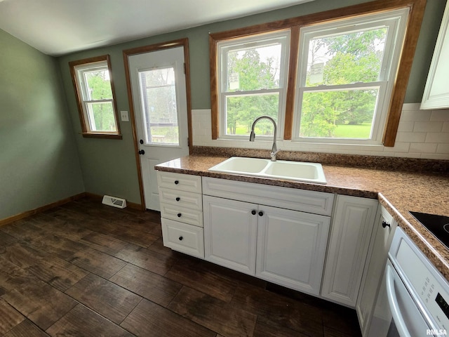 1471 Woods Ln, Centralia, IL 62801 - kitchen featuring decorative backsplash, white cabinets, and oven