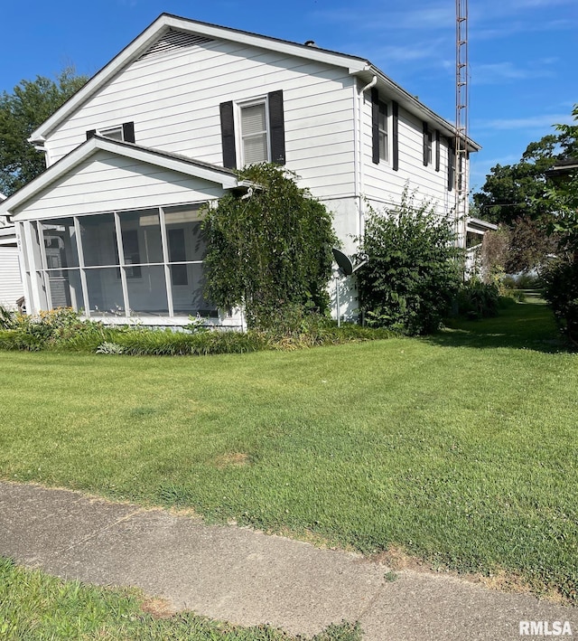 901 W Elm St, Carmi, IL 62821 - view of side of property with a sunroom and a yard