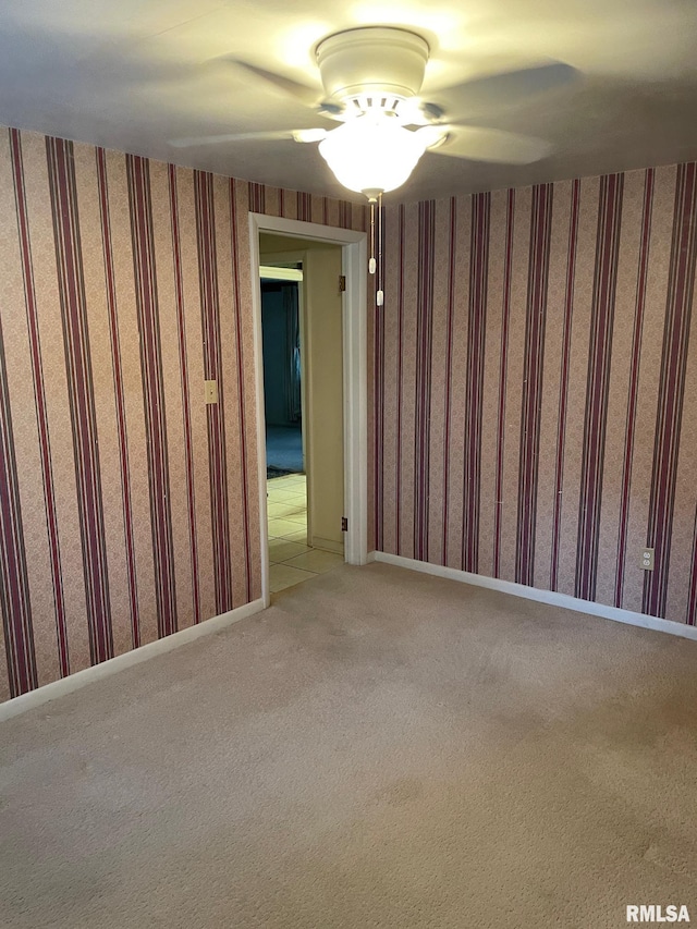 901 W Elm St, Carmi, IL 62821 - unfurnished room with light carpet, wallpapered walls, and a ceiling fan