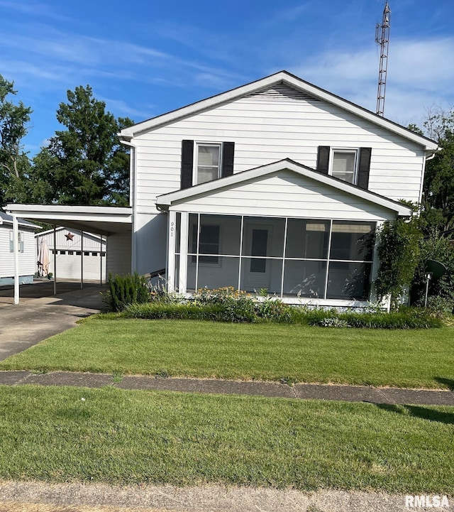 901 W Elm St, Carmi, IL 62821 - view of front of home featuring a sunroom, a carport, and a front yard