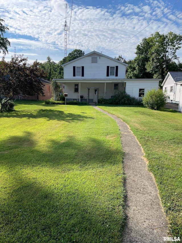 901 W Elm St, Carmi, IL 62821 - view of front facade with a front yard and a porch