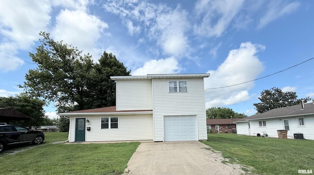 1002 Elm St, Marion, IL 62959 - view of front of house with concrete driveway, a front yard, and an attached garage