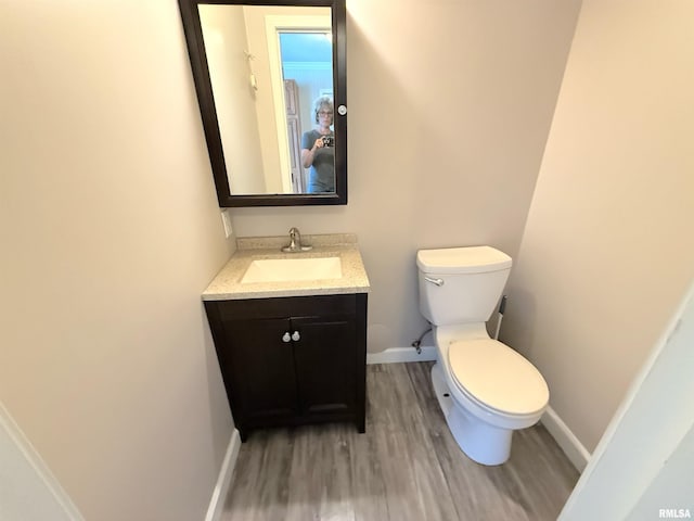 1002 Elm St, Marion, IL 62959 - bathroom with wood finished floors and vanity
