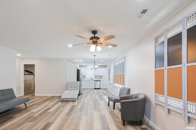 302 S Gray Dr, Carbondale, IL 62901 - living area with light wood-style floors, ceiling fan, recessed lighting, and a chandelier