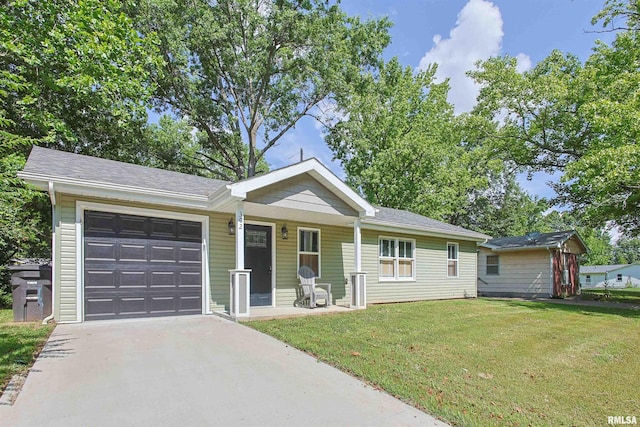 302 S Gray Dr, Carbondale, IL 62901 - single story home with driveway, an attached garage, a front lawn, and covered porch