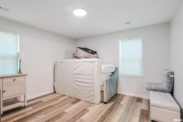 302 S Gray Dr, Carbondale, IL 62901 - laundry room with light wood finished floors and baseboards