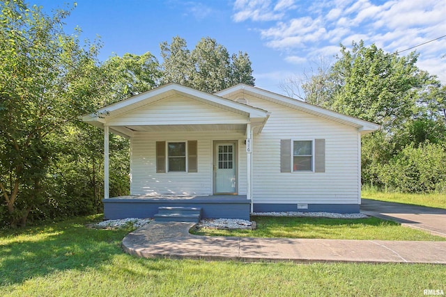 416 W Harrison St, Carrier Mills, IL 62917 - bungalow-style house with a porch, crawl space, and a front yard
