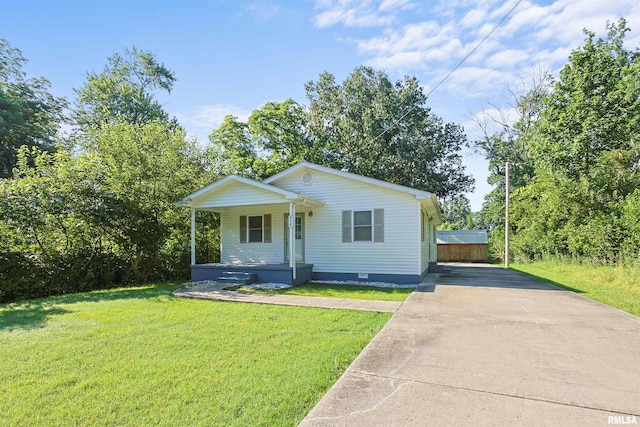 416 W Harrison St, Carrier Mills, IL 62917 - bungalow with covered porch, concrete driveway, a front lawn, and crawl space