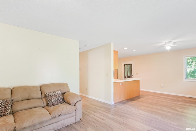 416 W Harrison St, Carrier Mills, IL 62917 - living room with light wood-style flooring, a ceiling fan, and recessed lighting