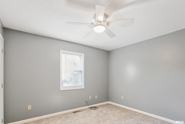416 W Harrison St, Carrier Mills, IL 62917 - carpeted spare room with ceiling fan and a textured ceiling