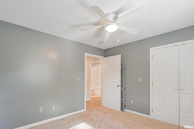 416 W Harrison St, Carrier Mills, IL 62917 - unfurnished bedroom featuring carpet floors, a closet, ceiling fan, and a textured ceiling