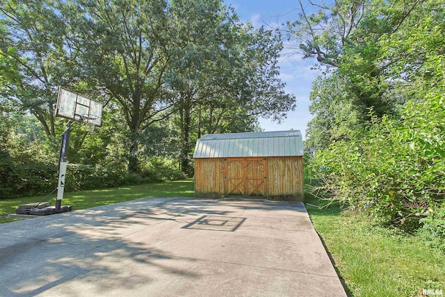 416 W Harrison St, Carrier Mills, IL 62917 - view of patio with a storage shed