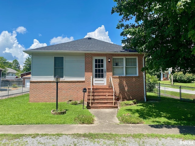 1915 E Oak St, West Frankfort, IL 62896 - bungalow-style home with entry steps, brick siding, and a shingled roof