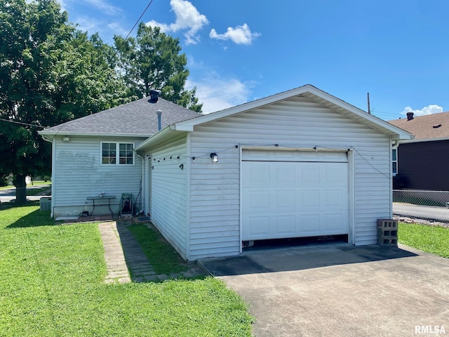 1915 E Oak St, West Frankfort, IL 62896 - view of side of home featuring driveway, an outdoor structure, and roof with shingles
