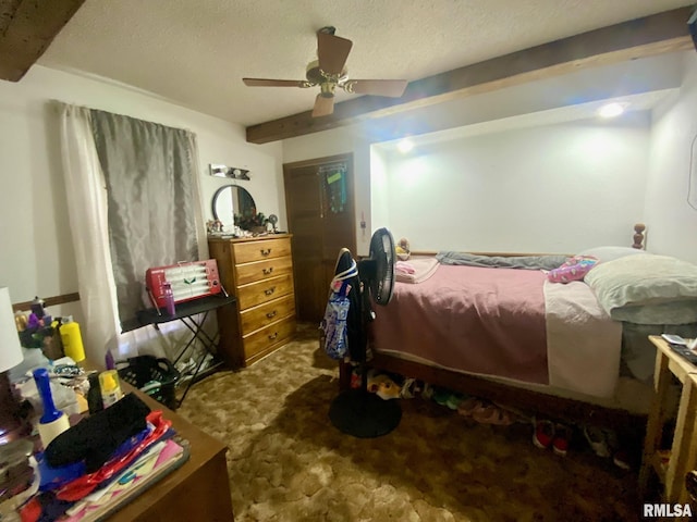 1915 E Oak St, West Frankfort, IL 62896 - carpeted bedroom with beamed ceiling, a textured ceiling, and a ceiling fan