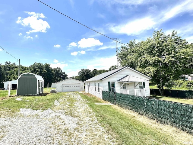 2448 E State Route 161st Rte, Centralia, IL 62801 - view of property exterior featuring a garage and a storage shed