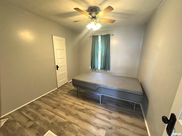2448 E State Route 161st Rte, Centralia, IL 62801 - bedroom featuring wood finished floors and ceiling fan
