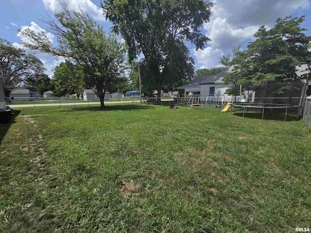 303 N Marion St, Centralia, IL 62801 - fenced backyard with a trampoline and a playground