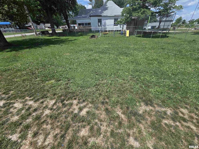303 N Marion St, Centralia, IL 62801 - fenced backyard featuring a trampoline