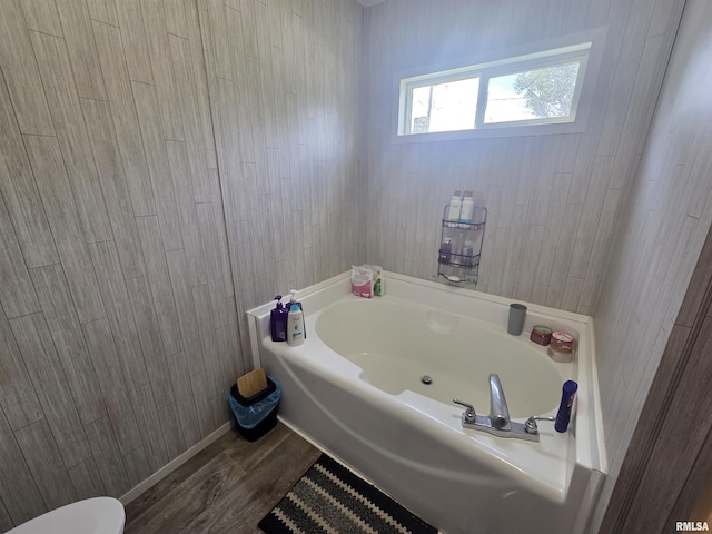 303 N Marion St, Centralia, IL 62801 - full bathroom with a garden tub and wood finished floors