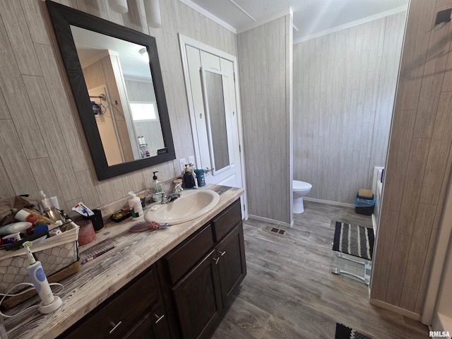 303 N Marion St, Centralia, IL 62801 - full bath featuring ornamental molding, vanity, wood finished floors, and wood walls
