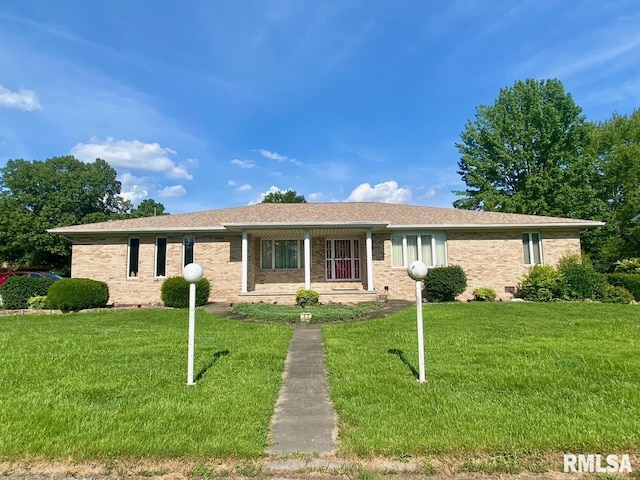 117 N Plains Ave, Marion, IL 62959 - ranch-style house featuring a front lawn, brick siding, and covered porch