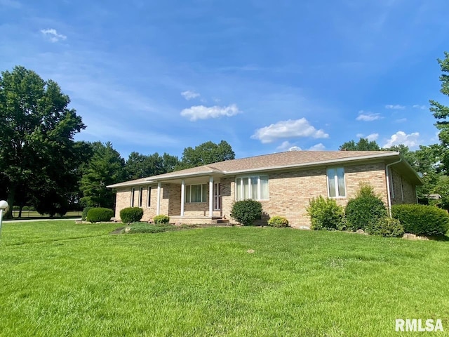 117 N Plains Ave, Marion, IL 62959 - ranch-style house featuring a front yard, brick siding, and covered porch
