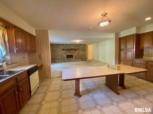 117 N Plains Ave, Marion, IL 62959 - kitchen featuring white dishwasher, light floors, a fireplace, and brown cabinets