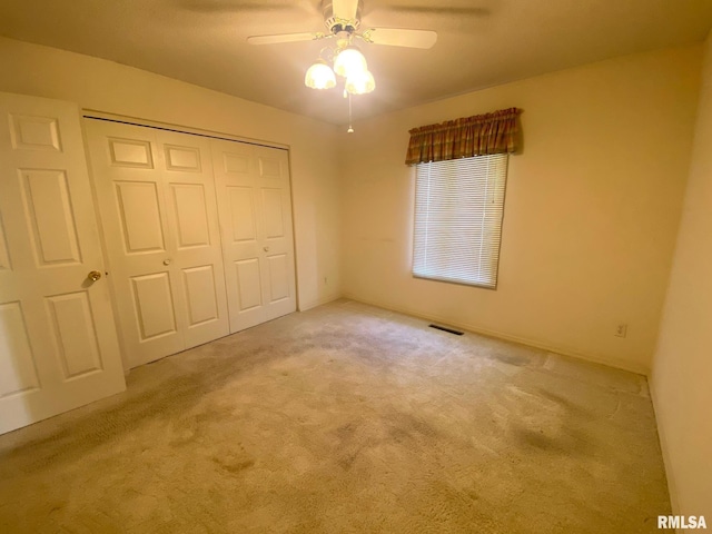 117 N Plains Ave, Marion, IL 62959 - unfurnished bedroom featuring carpet floors, a closet, and a ceiling fan