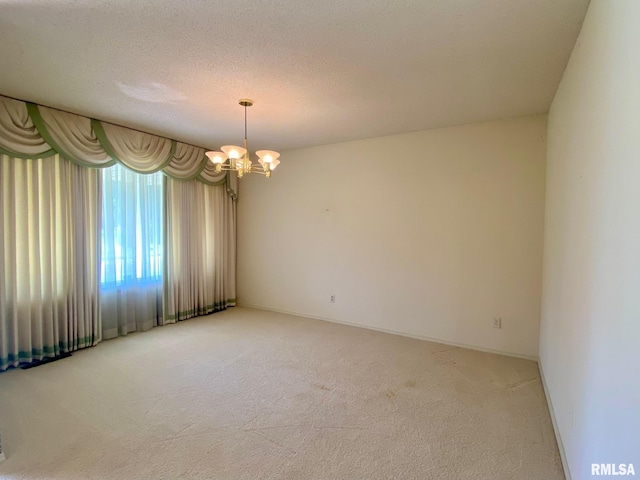 117 N Plains Ave, Marion, IL 62959 - unfurnished room featuring light carpet and a chandelier