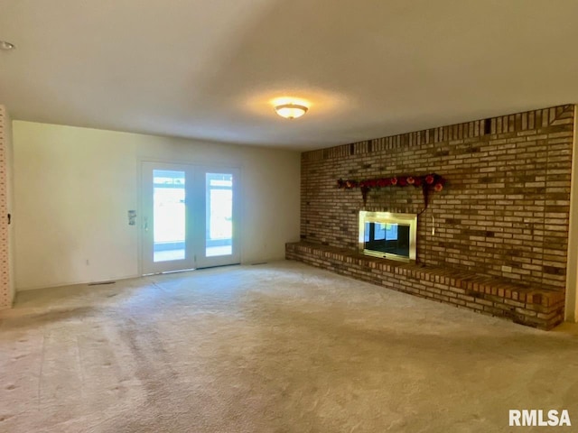 117 N Plains Ave, Marion, IL 62959 - unfurnished living room with carpet flooring and a brick fireplace