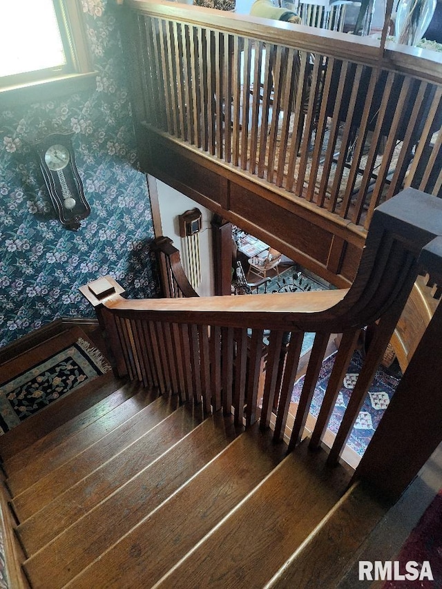 319 High St, Mound City, IL 62963 - staircase with wallpapered walls and wood finished floors