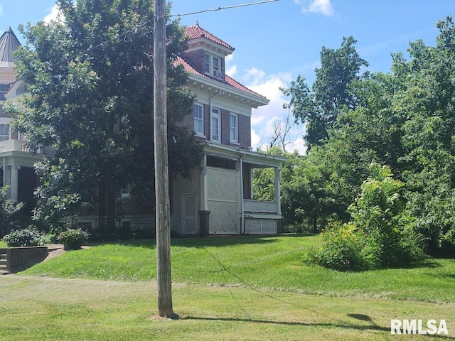 319 High St, Mound City, IL 62963 - view of property exterior with a lawn