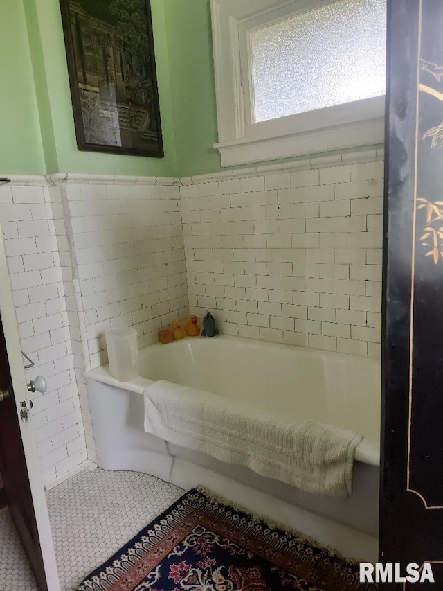 319 High St, Mound City, IL 62963 - bathroom featuring a garden tub and tile patterned floors