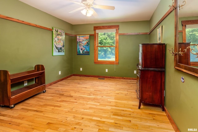 243 Pump Station Rd, Makanda, IL 62958 - bedroom with multiple windows, light wood-type flooring, and a ceiling fan